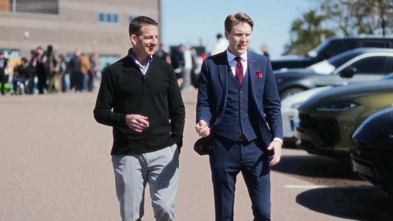 Rick Janson and Marcus Decherd walking through Village Automotive Supercar Saturday